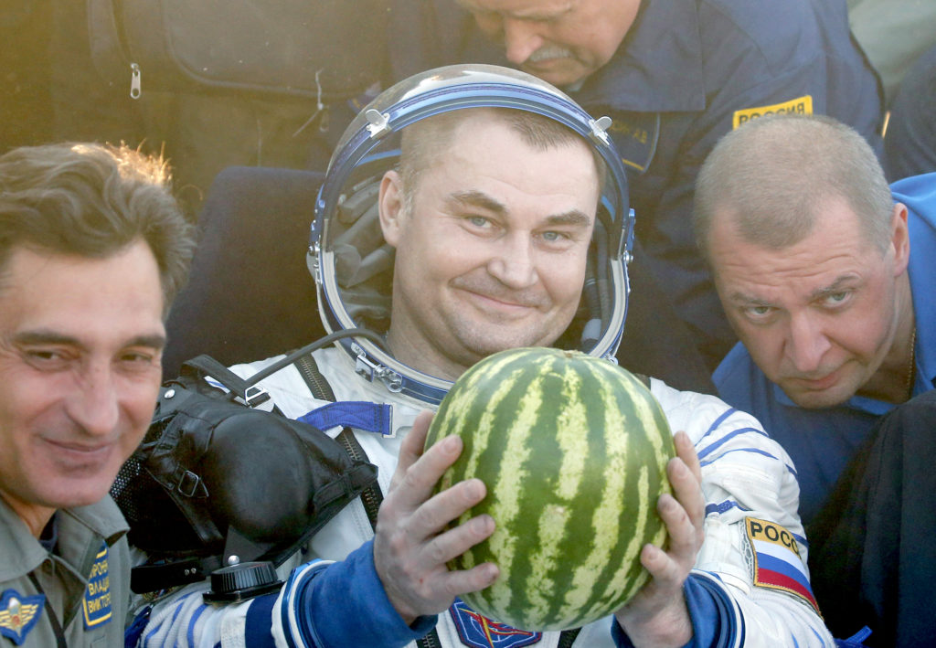 Russian cosmonauts Alexei Ovchinin, a member of the International Space Station crew, holds a water melon after landing some 150 km. to the East of the city of Dzhezkazgan in Kazakhstan, 07 September 2016.